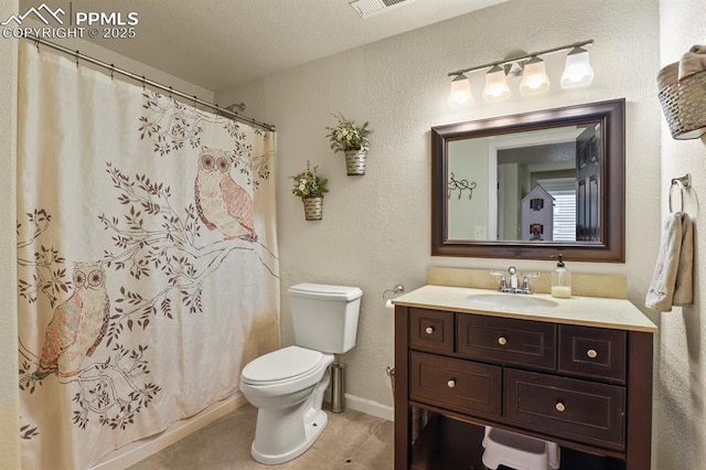 bathroom featuring vanity, a shower with curtain, baseboards, tile patterned flooring, and toilet