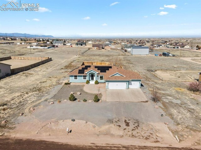 birds eye view of property with a mountain view