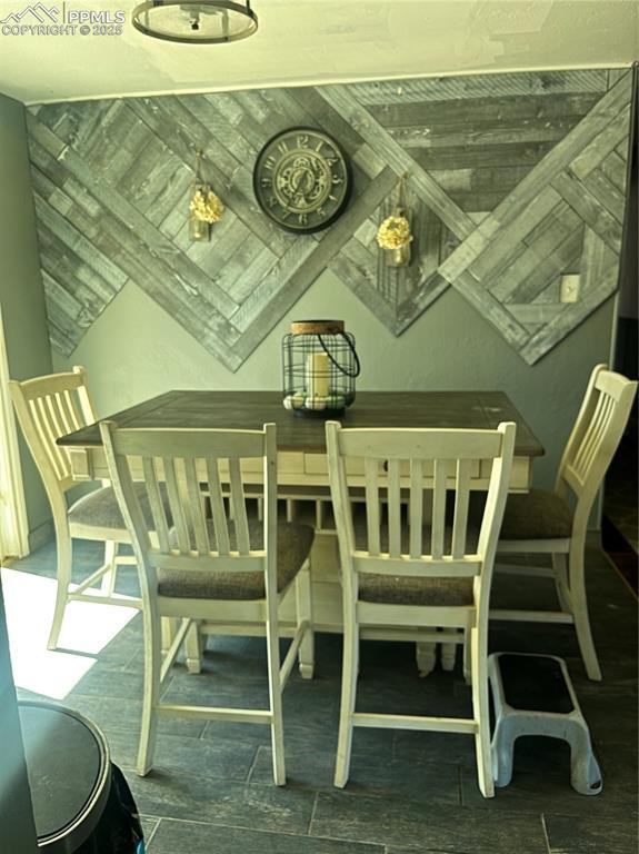 dining area featuring vaulted ceiling