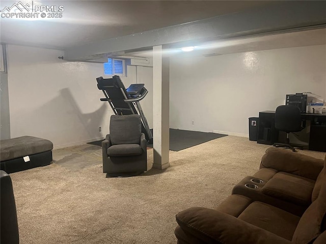 workout room featuring carpet and baseboards