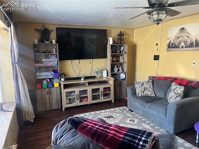 living room featuring wood finished floors and ceiling fan