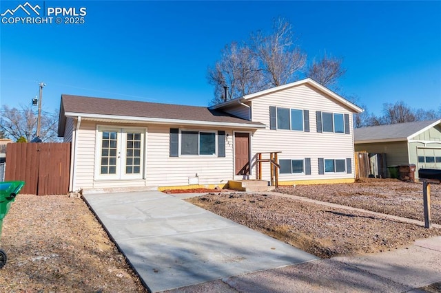 tri-level home featuring french doors