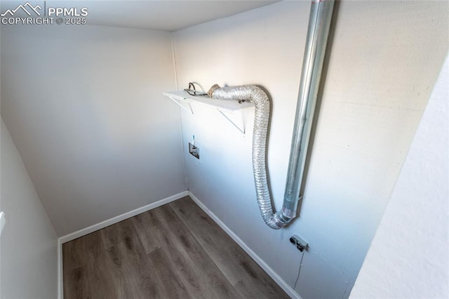 washroom featuring hookup for a washing machine, baseboards, and wood finished floors