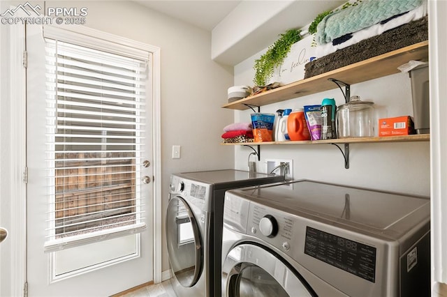 laundry room with washer and clothes dryer and laundry area