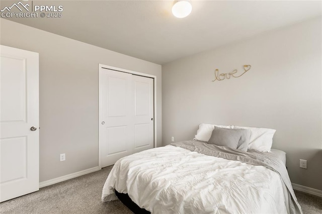 carpeted bedroom featuring baseboards