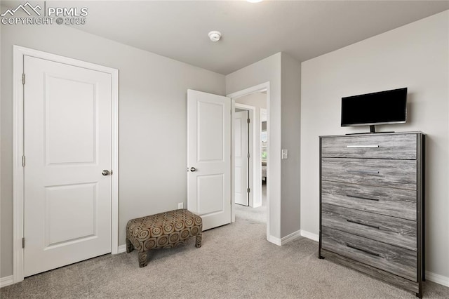 bedroom with carpet flooring and baseboards