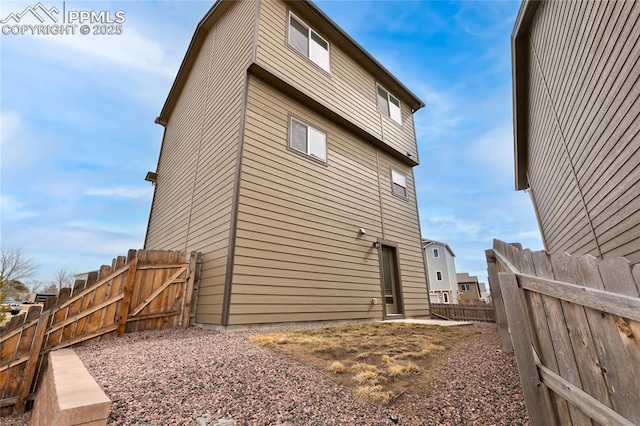 view of property exterior with fence