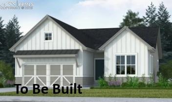 modern farmhouse style home with metal roof, board and batten siding, an attached garage, and a standing seam roof