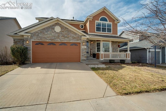 view of front facade with stone siding, covered porch, concrete driveway, and an attached garage