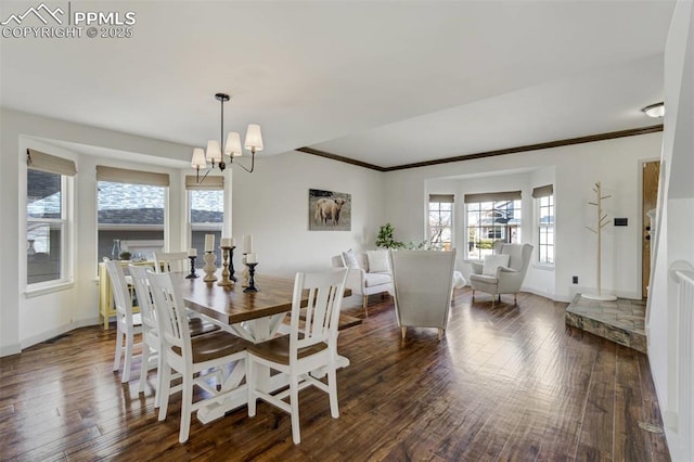 dining space with baseboards, ornamental molding, and hardwood / wood-style flooring