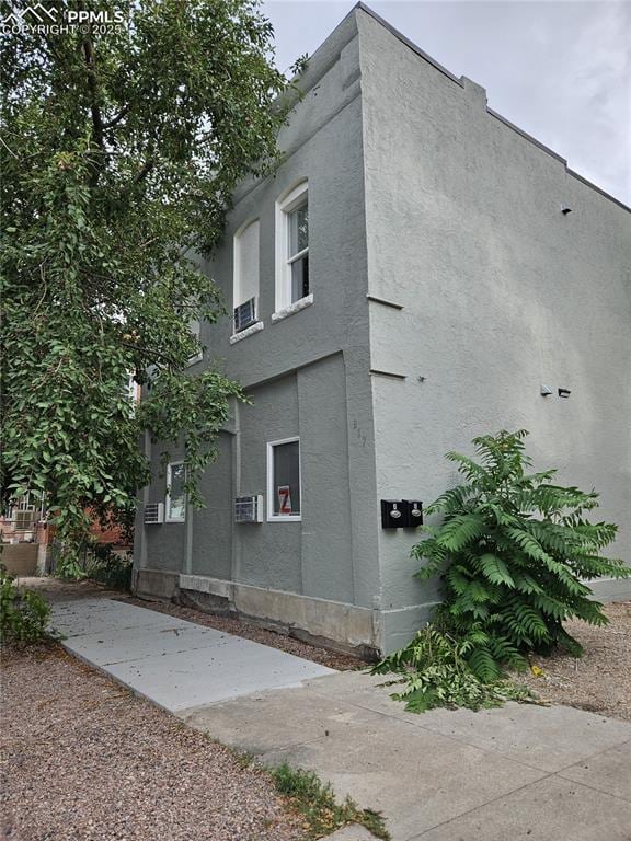 view of side of home featuring stucco siding