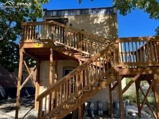 view of jungle gym with stairs and a deck