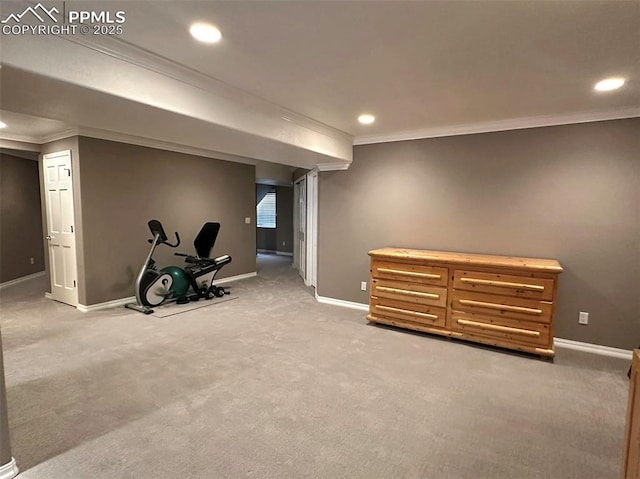 finished basement with light carpet, recessed lighting, crown molding, and baseboards