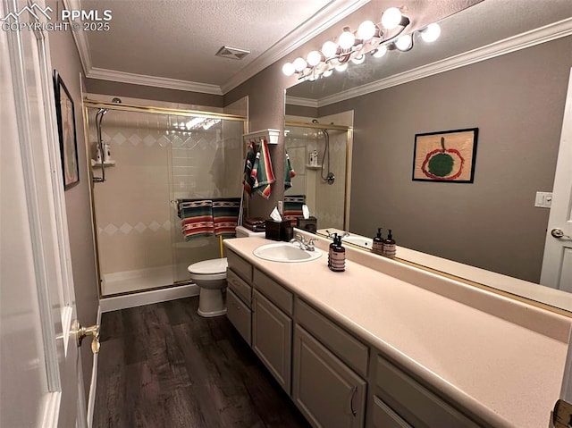 bathroom featuring visible vents, ornamental molding, a stall shower, wood finished floors, and a textured ceiling