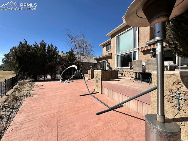 view of patio with fence