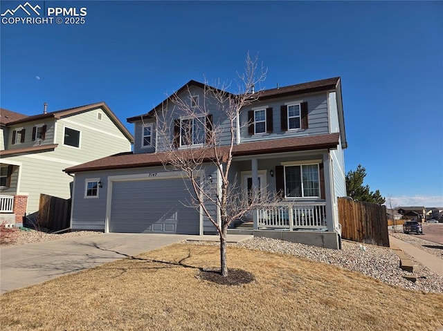 traditional-style home featuring a porch, concrete driveway, an attached garage, and fence