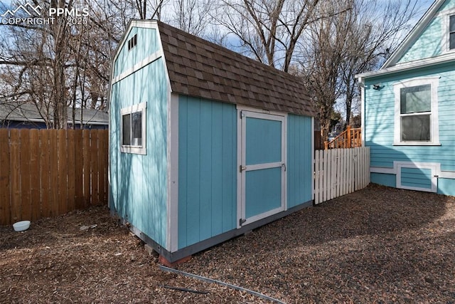 view of shed featuring a fenced backyard