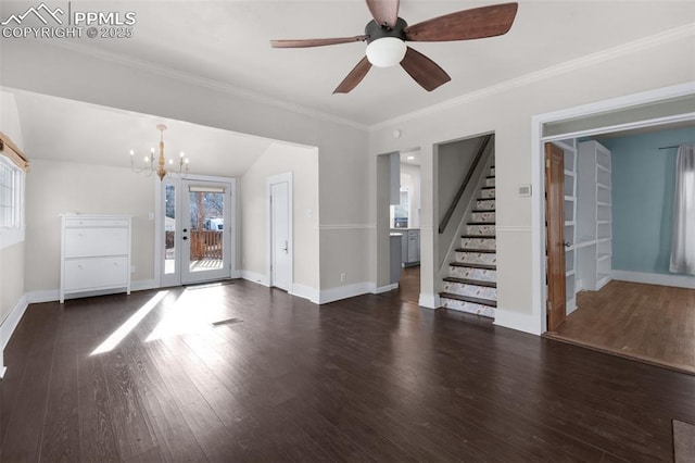 unfurnished living room with stairway, wood finished floors, baseboards, visible vents, and ornamental molding