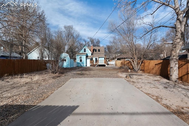 view of yard with a patio area and a fenced backyard