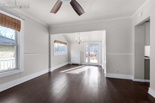 interior space featuring baseboards, ceiling fan with notable chandelier, wood finished floors, and ornamental molding