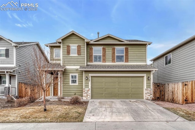 view of front of property featuring concrete driveway, an attached garage, fence, and a shingled roof