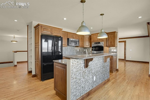 14060 Black Forest Rd, Colorado Springs, CO 80908 - kitchen with baseboards, tasteful backsplash, brown cabinetry, and stainless steel appliances
