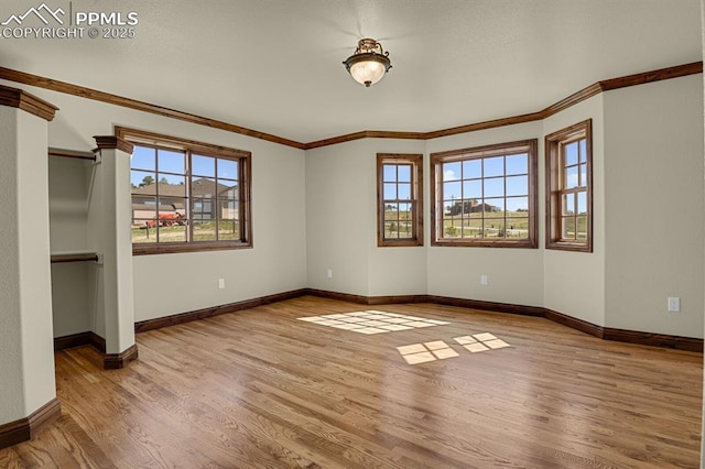 14060 Black Forest Rd, Colorado Springs, CO 80908 - unfurnished bedroom featuring baseboards, wood finished floors, and ornamental molding