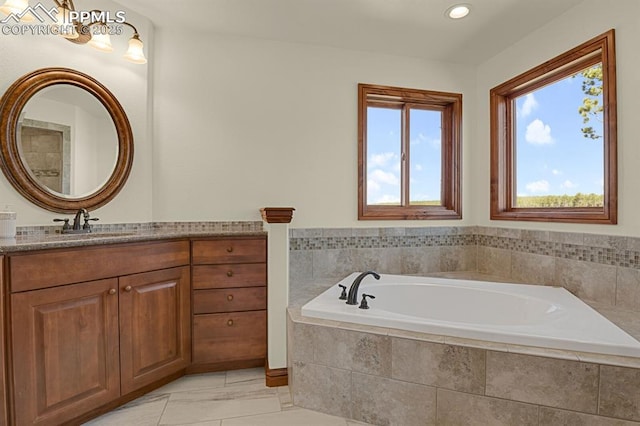 14060 Black Forest Rd, Colorado Springs, CO 80908 - bathroom featuring recessed lighting, a garden tub, vanity, and plenty of natural light