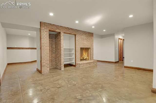 14060 Black Forest Rd, Colorado Springs, CO 80908 - unfurnished living room featuring baseboards, a fireplace, concrete flooring, and recessed lighting