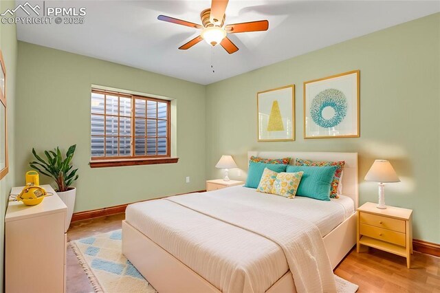 14060 Black Forest Rd, Colorado Springs, CO 80908 - bedroom with wood finished floors, baseboards, and ceiling fan