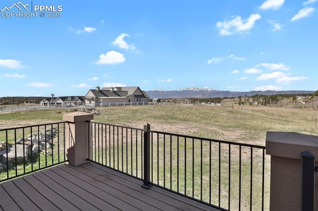 14060 Black Forest Rd, Colorado Springs, CO 80908 - wooden terrace featuring a rural view and a mountain view