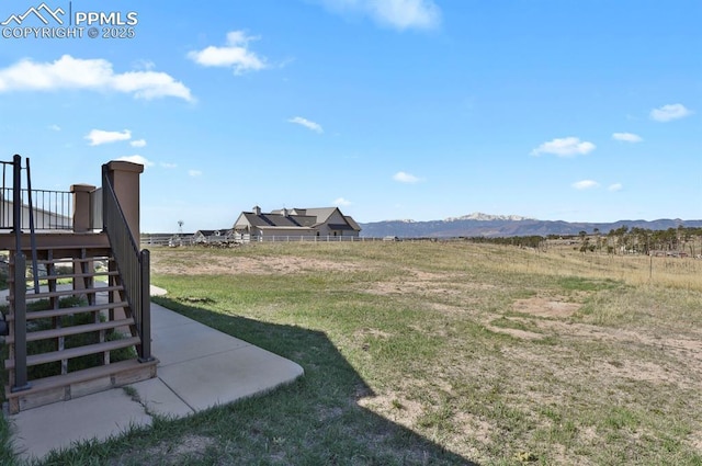 14060 Black Forest Rd, Colorado Springs, CO 80908 - view of yard featuring stairs and a mountain view