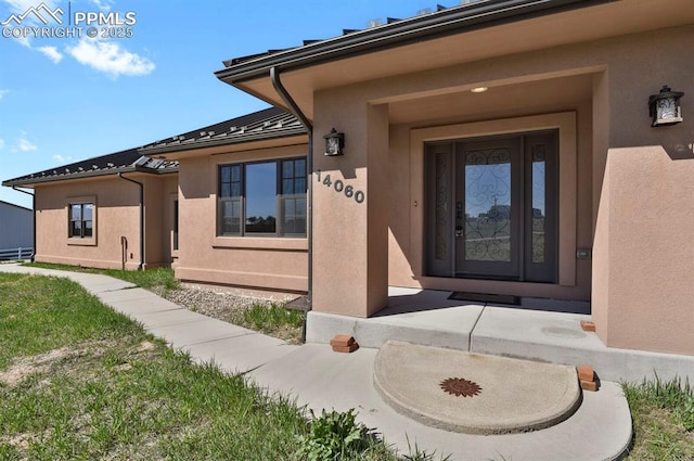 14060 Black Forest Rd, Colorado Springs, CO 80908 - entrance to property with stucco siding