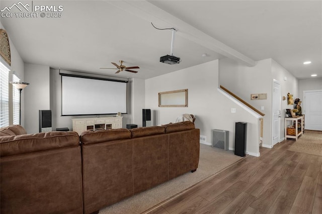 home theater room featuring a ceiling fan, wood finished floors, baseboards, beam ceiling, and recessed lighting