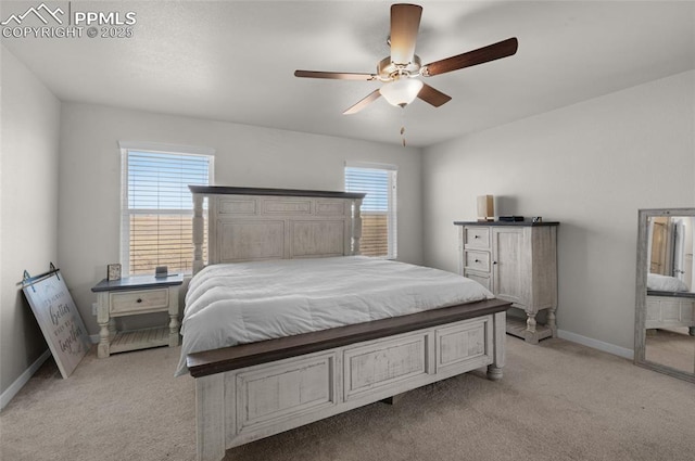 bedroom with multiple windows, baseboards, and light carpet