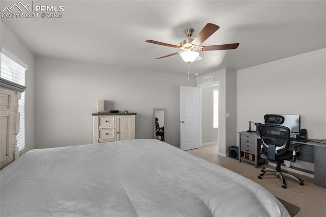 bedroom featuring visible vents, ceiling fan, and carpet