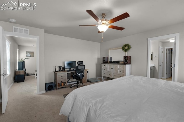 carpeted bedroom featuring visible vents, baseboards, and a ceiling fan