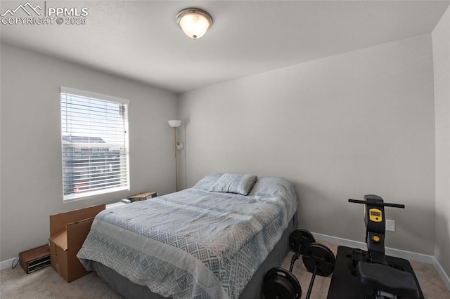 bedroom with carpet and baseboards