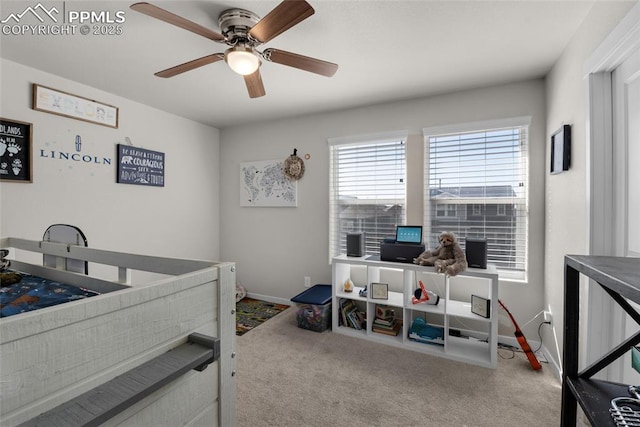 carpeted bedroom featuring baseboards and ceiling fan