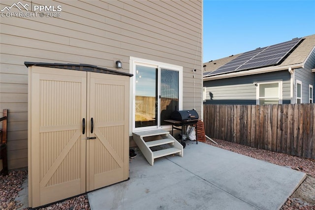 view of patio / terrace featuring entry steps, area for grilling, and fence