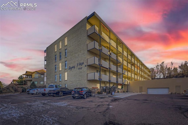 view of property with uncovered parking