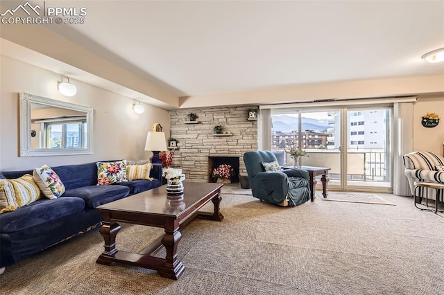 living room featuring a fireplace and carpet