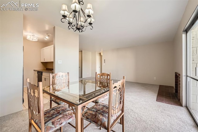 dining area featuring light carpet and a notable chandelier