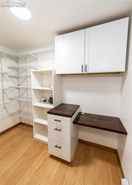 spacious closet with light wood-style flooring