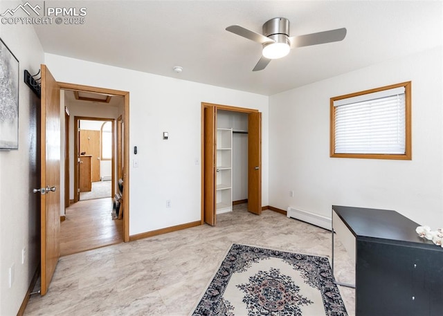 bedroom with multiple windows, ceiling fan, baseboards, and a baseboard radiator