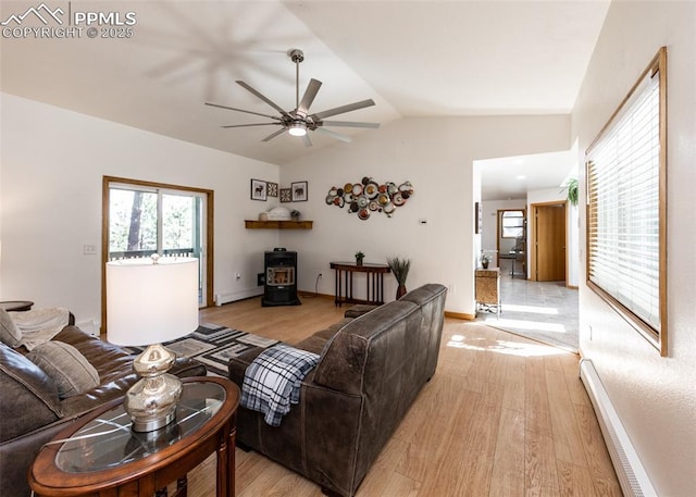 living area with baseboard heating, a ceiling fan, light wood-type flooring, and lofted ceiling