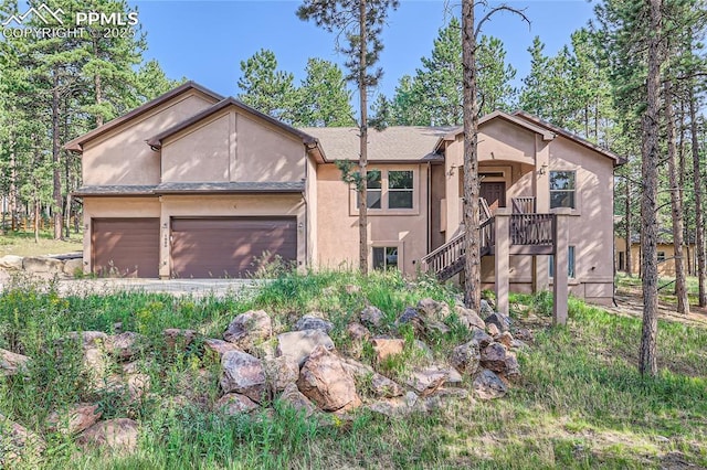 view of front of property featuring stucco siding and a garage