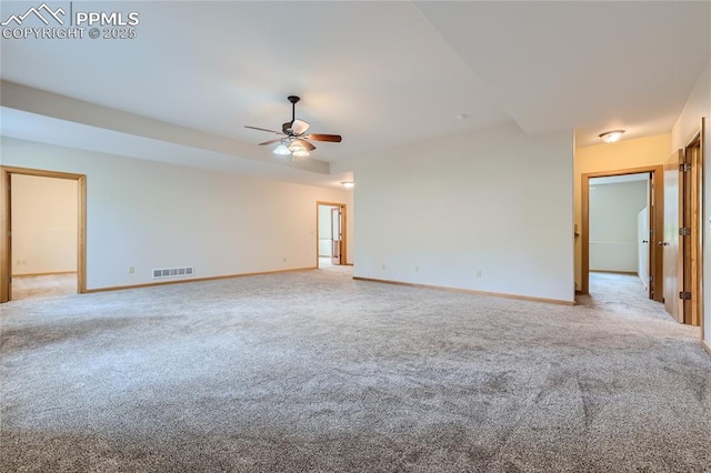 unfurnished room featuring carpet flooring, baseboards, and visible vents