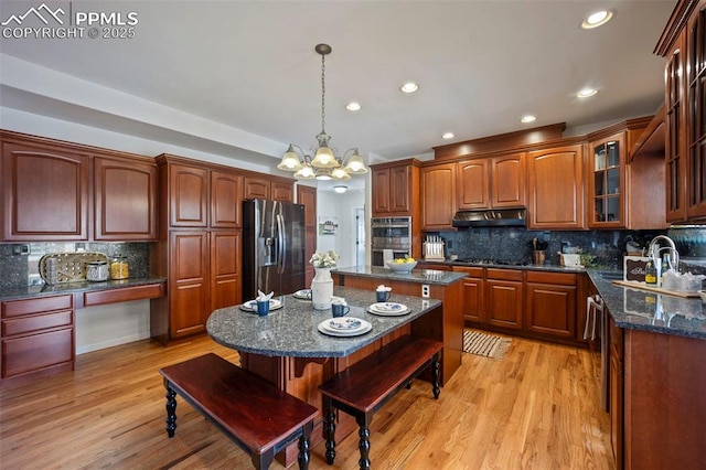 14650 Eastonville Rd, Elbert, CO 80106 - kitchen featuring a kitchen island, a sink, under cabinet range hood, stainless steel appliances, and recessed lighting