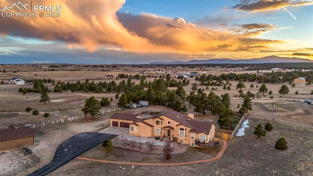 14650 Eastonville Rd, Elbert, CO 80106 - aerial view at dusk featuring a mountain view